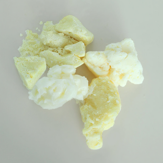 Variety of cosmetic butters on a light gray background