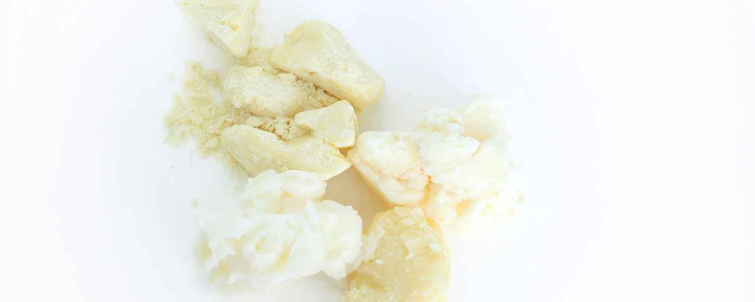 Variety of cosmetic butter pieces on white background