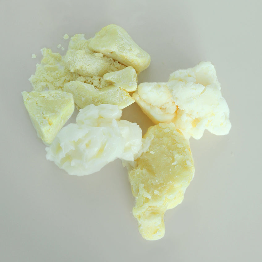 Variety of cosmetic butters on a light gray background