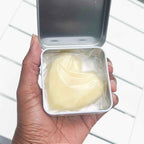 Hand holding solid body butter level 3 cocoa coeur packaging