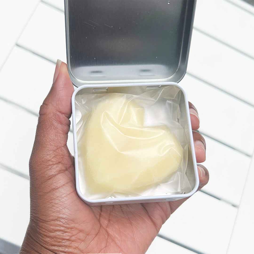 Hand holding solid body butter level 3 cocoa coeur packaging
