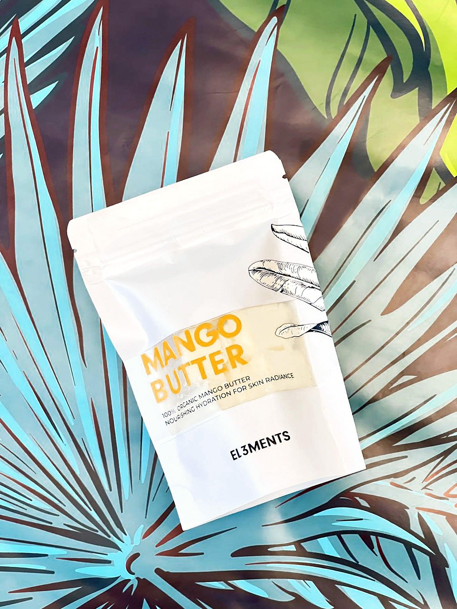 Mango butter packaging with El3ments branding on a leafy background
