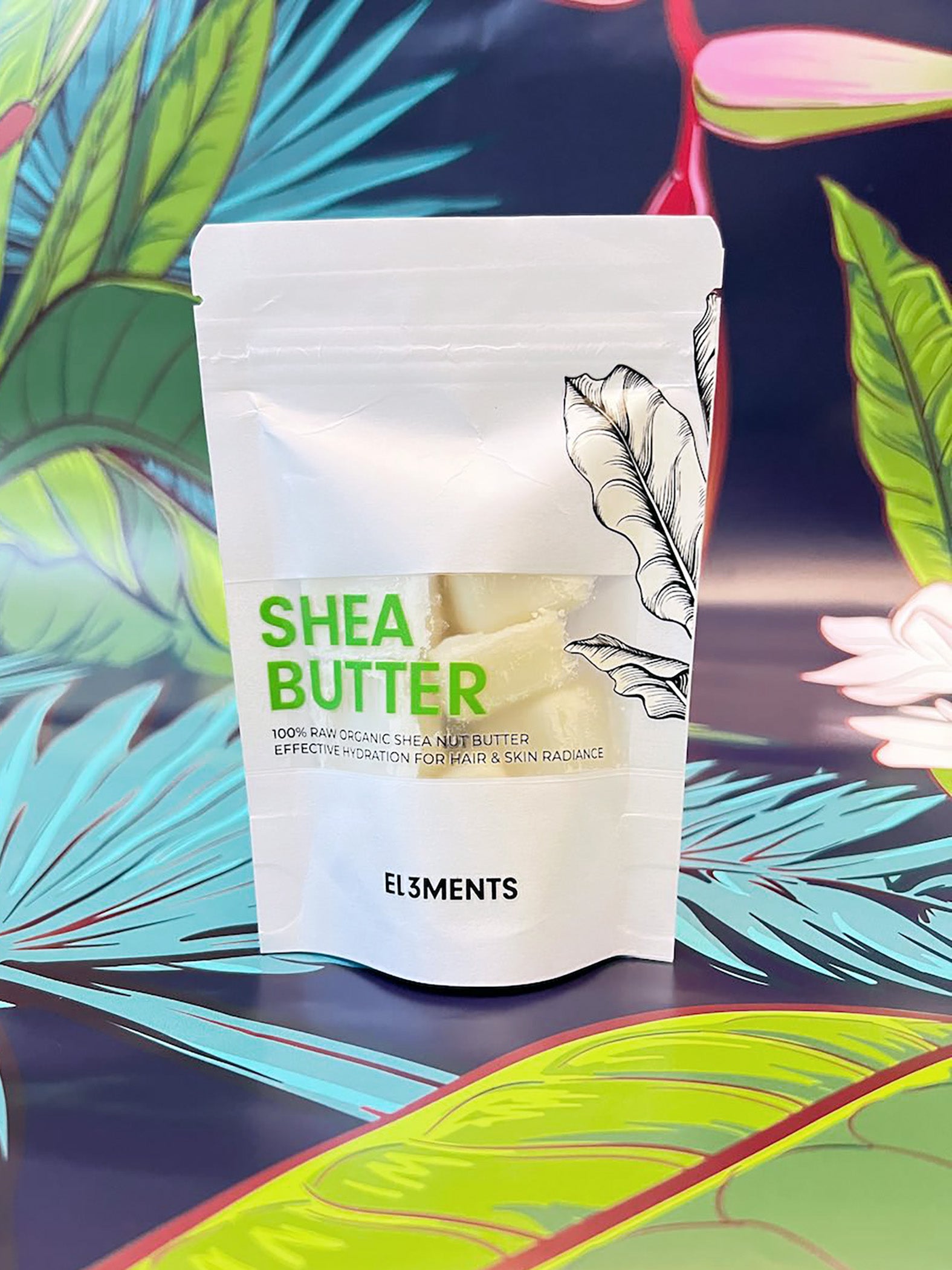 Shea butter packaging with a colorful leafy background